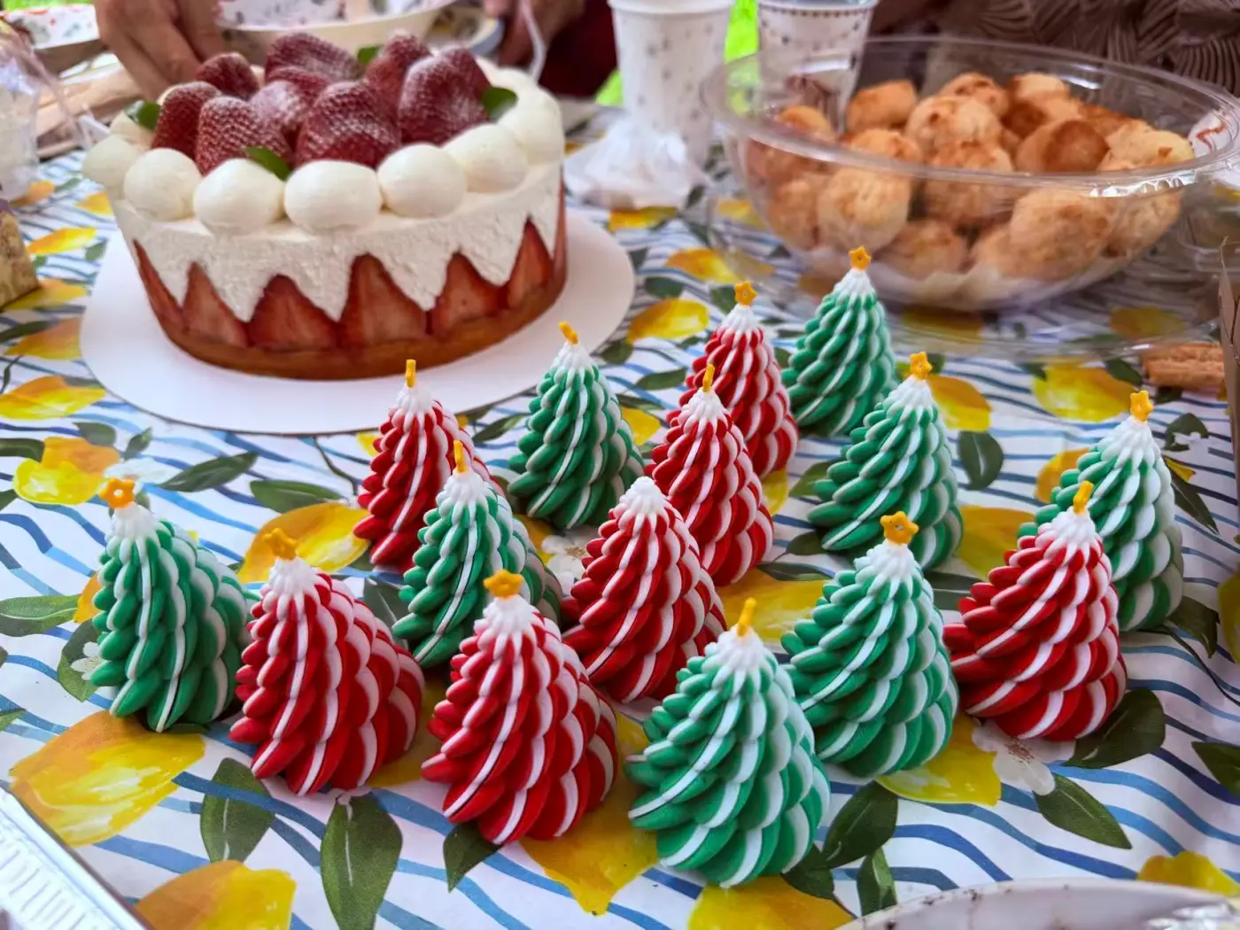 Dessert table at the club Christmas party — strawberry cake and meringue Christmas trees
